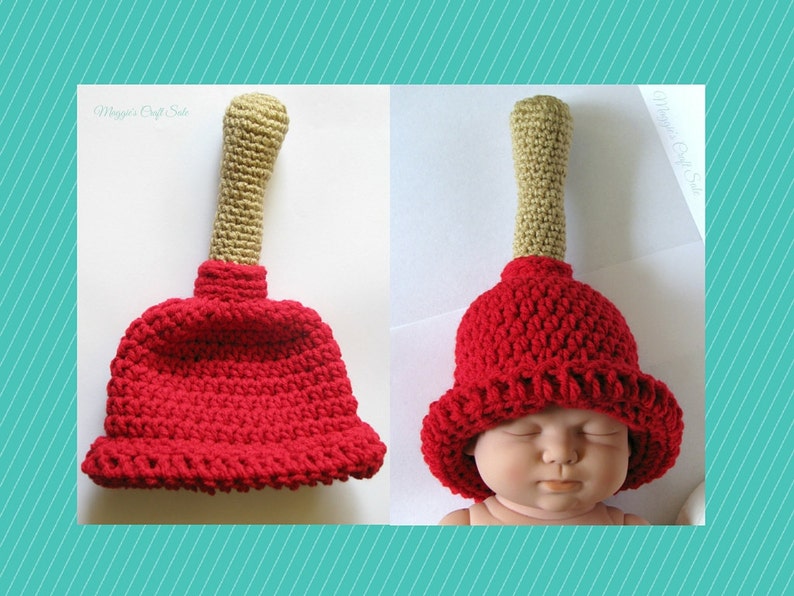 Puede incluir: Un gorro de ganchillo rojo y beige con forma de &eacute;mbolo. El gorro lo lleva un beb&eacute;.