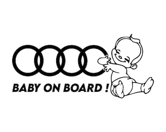 May include: Black and white car decal with the text "BABY ON BOARD!" and a cartoon baby. The decal also features the four interlocking rings logo.
