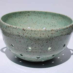 Ceramic berry bowl colander. speckled clay aqua glaze. Medium sized, holds three cups