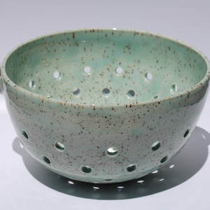 Ceramic berry bowl colander. speckled clay aqua glaze. Medium sized, holds three cups