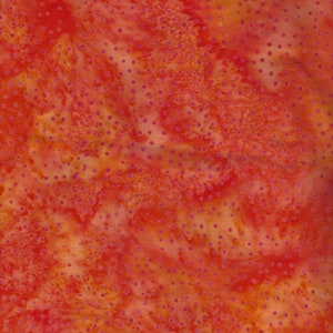 100% Cotton Fabric Print is Orange Batik with dots