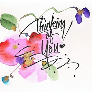 May include: Watercolor painting of pink and red flowers with green leaves and a black calligraphy inscription that says "Thinking of You" with a small heart.