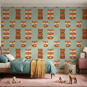 May include: A bedroom featuring wallpaper with a repeating pattern of cartoon foxes and bears on a sage green background. The room includes a wooden bed with teal bedding, a yellow throw blanket, a pink nightstand, and various animal-themed decor.