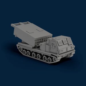 May include: A gray model of a military vehicle with a multiple launch rocket system. The vehicle has a tracked chassis, a crew compartment, and a large launcher with multiple rocket tubes. The background is a dark blue.