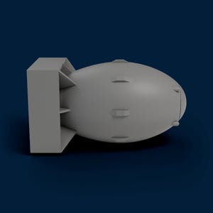 May include: A gray, stylized bomb model with a cylindrical body and a rectangular tail section. The model has several small, rectangular protrusions along its body. The background is a solid, dark blue.