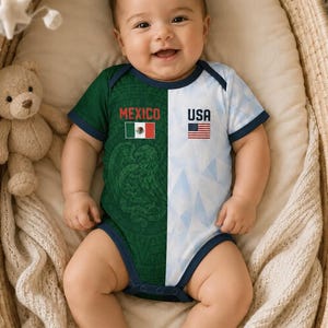 May include: A baby wearing a split-design onesie. One side features the Mexican flag and the word "MEXICO", the other side displays the American flag and the word "USA". The onesie is green and white with navy blue trim.