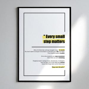 May include: A framed print with a black border and white background. The text "Every small step matters" is in yellow and black. Additional text in black provides motivational quotes about progress and consistency.