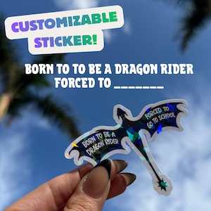 May include: A dragon-shaped holographic sticker against a blue sky. The sticker says "BORN TO BE A DRAGON RIDER FORCED TO..." and "FORCED TO GO TO SCHOOL". The top text says "CUSTOMIZABLE STICKER!"
