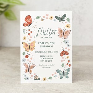 May include: A colourful invitation with a butterfly theme. The invitation reads "flutter on over for Poppy's 6th Birthday!"  The invitation includes the date, time, and location of the party.