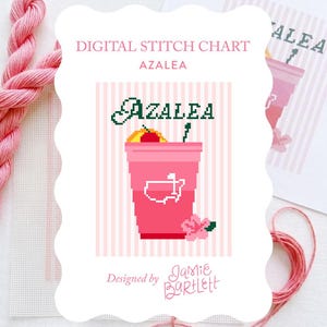May include: A digital stitch chart titled "Azalea" features a pink pixelated drink with a cherry and a flower. The design is set against a pink and white striped background. Pink embroidery floss and white fabric are visible.