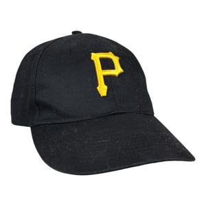 May include: Black baseball cap featuring a yellow embroidered "P" logo. The cap has a curved peak and a rounded crown. A classic style hat, suitable for sports or casual wear.