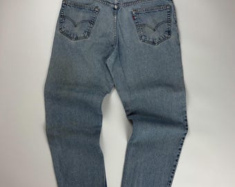Vintage Levis Denim Jeans / 550 Relaxed Fit / Light Wash Pants / Distressed Bottoms / 36x31 Blue