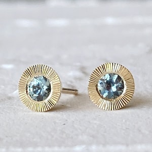 Large Aurora Stud Earrings, Teal Montana Sapphire and Yellow gold halo with engraving, radiant sunburst engraved border, second hole post