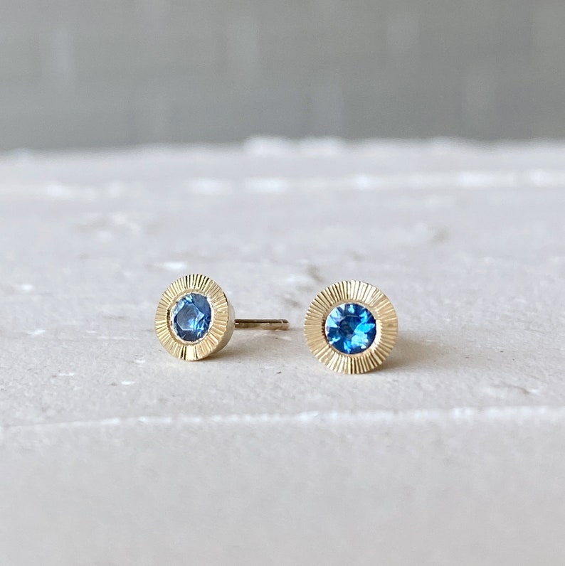 Large Aurora Stud Earrings, Blue Montana Sapphire and Yellow gold halo with engraving, radiant sunburst engraved border, second hole post image 6