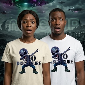 May include: Two short-sleeved crew neck t-shirts, one in cream and one in white, each featuring a graphic of a purple alien performing a dab pose. The text "UFO DISCLOSURE" is printed in dark blue block letters below the alien figure on both shirts.