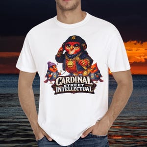 May include: White t-shirt with a cartoon owl wearing headphones, a gold chain, and a microphone. Two smaller birds flank the owl. The text "CARDINAL STREET INTELLECTUAL" is displayed below the owl.