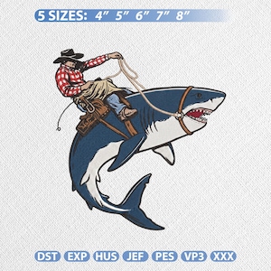 May include: Embroidered design featuring a cowboy riding a shark, holding a rope. The cowboy wears a plaid shirt and hat. The shark is blue and white with a detailed open mouth. Text at the top reads "5 SIZES: 4" 5" 6" 7" 8".
