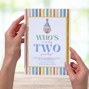May include: A birthday party invitation with a baby's face wearing a party hat. The invitation has a striped border in pastel colors and text that reads "WHO'S ready TWO party?" and event details.
