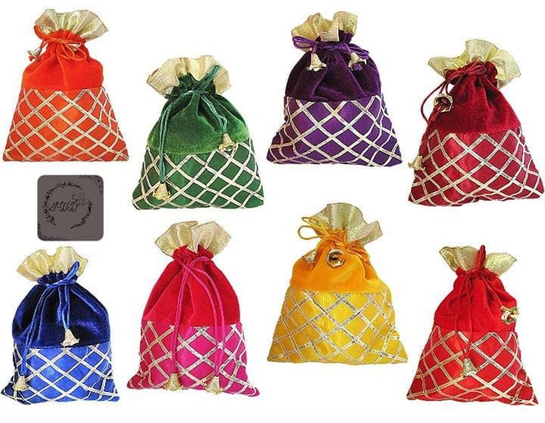 May include: Assortment of colorful velvet drawstring bags. Each bag features a contrasting gold-colored top and a diamond-patterned lower section. Colors include red, orange, green, purple, blue, pink, and yellow. Ideal for small gifts or party favors.
