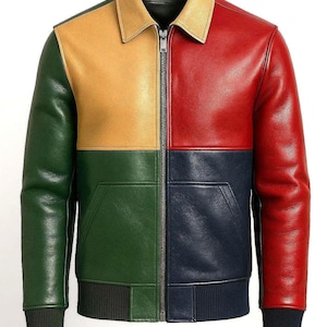 May include: A multi-colored leather jacket with a zip-up front. The jacket features a color-block design with green, yellow, red, and navy blue panels. It has a collared neckline, two front pockets, and ribbed cuffs and hem.