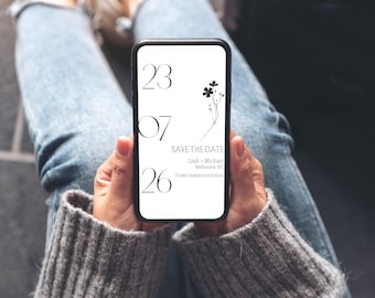 Puede incluir: Un teléfono inteligente muestra un anuncio minimalista de "Save the Date". El diseño presenta la fecha, una ilustración floral y los nombres Leah y Michael, con una ubicación en Melbourne, VIC. El fondo es blanco, con texto negro y un teléfono negro.