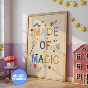 May include: A framed print with the words "MADE OF MAGIC" in colorful letters, decorated with stars, a rocket, and other whimsical illustrations. A blue circle with the words "DIGITAL DOWNLOAD" is in the foreground. A mushroom stool and dollhouse are also visible.