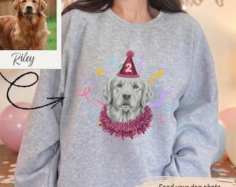 May include: A light gray sweatshirt featuring a custom dog portrait wearing a party hat with the number 2. The sweatshirt includes the text "Send your dog photo we turn it into custom art + add your text/name". A photo of a golden retriever is also included.