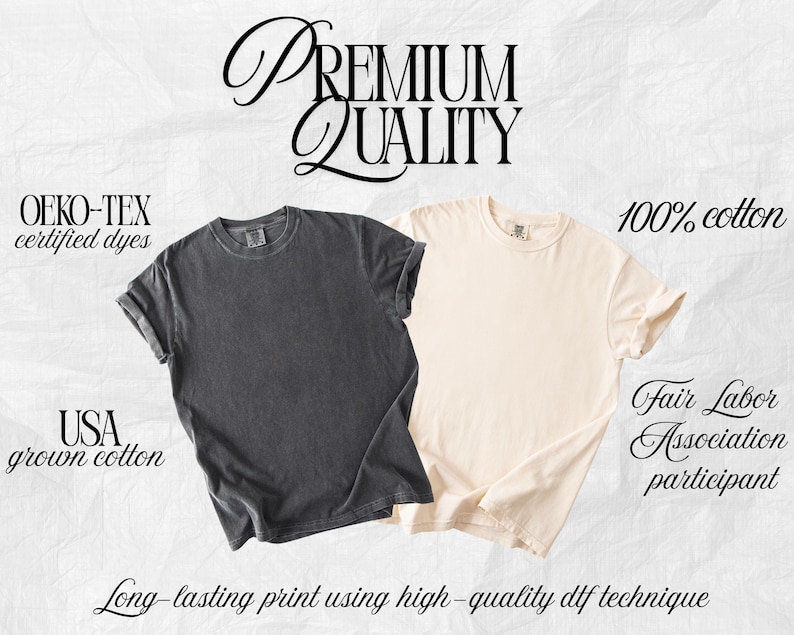 May include: Two short-sleeve crew neck t-shirts, one in charcoal gray and one in cream. Text includes: PREMIUM QUALITY, OEKO-TEX certified dyes, 100% cotton, USA grown cotton, Fair Labor Association participant, and Long-lasting print using high-quality dtf technique.