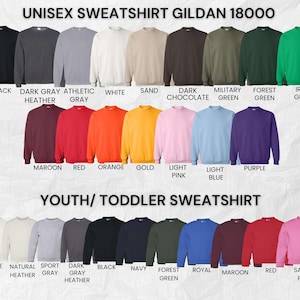 May include: A product display featuring Gildan 18000 unisex and youth/toddler sweatshirts in various colors. The unisex sweatshirts include black, dark gray, white, sand, and more. Youth/toddler options include white, gray, black, navy, and others.