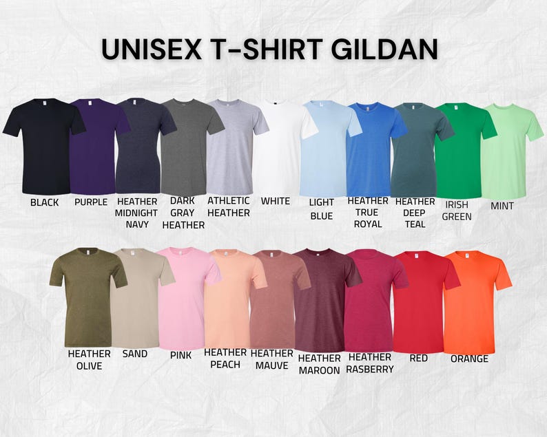 K&ouml;nnte beinhalten: Eine Auswahl an Gildan Unisex-T-Shirts in verschiedenen Farben, darunter Schwarz, Lila, Heather Navy, Dunkelgrau, Athletic Heather, Wei&szlig;, Hellblau, Heather Royal, Deep Teal, Irish Green und Mint. Weitere Farben sind Heather Olive, Sand, Pink, Heather Peach, Heather Mauve, Heather Maroon, Heather Raspberry, Rot und Orange.
