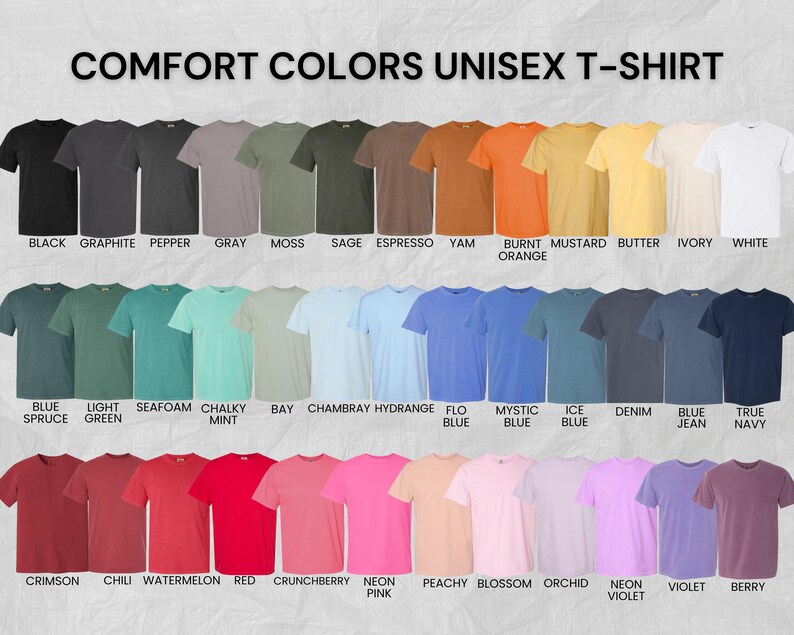 May include: A color chart displaying Comfort Colors unisex t-shirts in forty-two distinct shades, arranged in three rows. Each shirt is labeled with its specific color name, ranging from black, gray, and earth tones to vibrant blues, reds, and pinks.