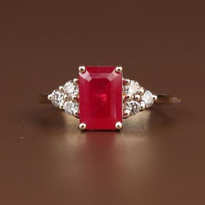 2ct Emerald Cut Red Lab Diamond Engagement Ring | Hidden Halo | 14K Yellow Gold | Pave Cluster Side Stone | Type IIa | IGI Certified Ruby
