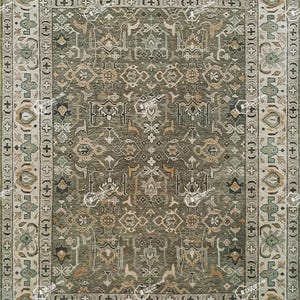 May include: A rectangular area rug with an intricate, symmetrical pattern in shades of green, beige, and brown. The rug features a central field with floral and geometric motifs, framed by a detailed border. The design is reminiscent of traditional oriental rugs.