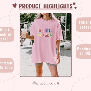 May include: A light pink t-shirt with the text "Girl Mama" in colorful block letters. The shirt is made of 100% US cotton and is handmade in the USA. The design is made to not crack or peel.