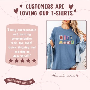 May include: A blue t-shirt with the text "Girl Mama" in colorful block letters. The image also includes text that says "Customers are loving our t-shirts" and "Handmade with".