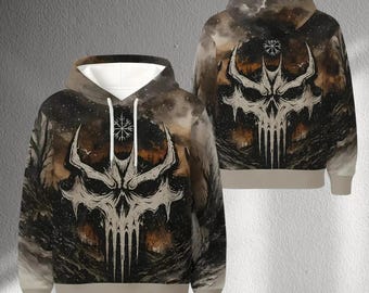 May include: A hooded sweatshirt featuring a detailed skull design with a dark, atmospheric background. The front and back of the hoodie display the same graphic, with a white and beige color scheme. The design includes a symbol above the skull.