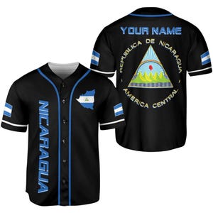 May include: Black baseball jersey with blue and white accents. Features the word "NICARAGUA" vertically down the front, a map of Nicaragua, and the text "YOUR NAME" on the back. The back also displays the Nicaraguan coat of arms.