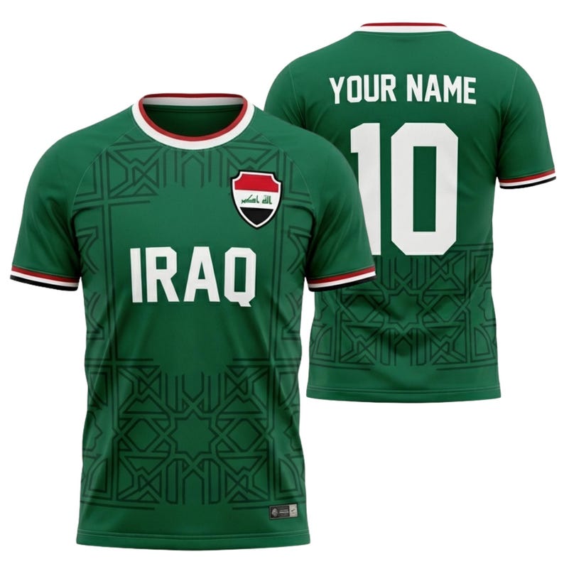 May include: Green soccer jersey with the word "IRAQ" in white block letters. The jersey has a white and red trim on the collar and sleeves. The number "10" is on the back, with the words "YOUR NAME" above it.