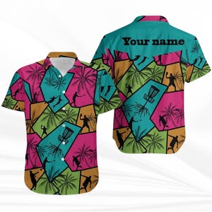 May include: A short-sleeved shirt with a vibrant geometric design. The pattern includes palm trees, disc golf figures, and disc golf baskets in teal, pink, orange, and green. The text "Your name" is printed on the back of the shirt.