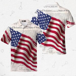 May include: A short-sleeved polo shirt featuring a distressed American flag design. The shirt's design incorporates the Declaration of Independence text and the American flag with red and white stripes and blue stars.