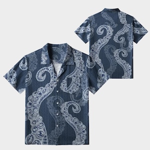 May include: Navy blue short-sleeve button-down shirt featuring a repeating pattern of white octopus tentacles. The shirt has a classic collar and a single chest pocket. The design includes a subtle wave pattern in the background.