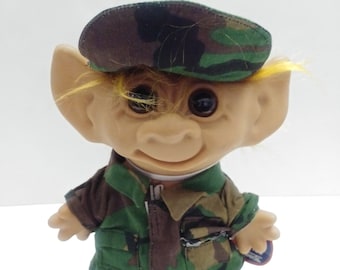 troll doll with horseshoes on feet