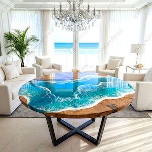 Puede incluir: Una mesa de centro redonda con un diseño único con temática oceánica. La mesa presenta una base de madera y una tapa con un diseño de resina azul y blanca que imita las olas del océano. La mesa está sostenida por una base de metal negro.