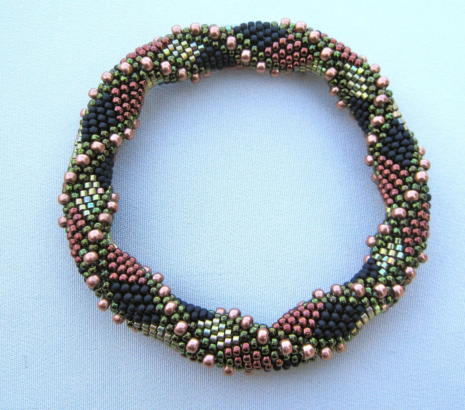 30 Beaded Crochet Patterns to Add Sparkle, Texture, and Giftable Charm 26 Double Reverse Spiral Bead Crochet Bangle Pattern