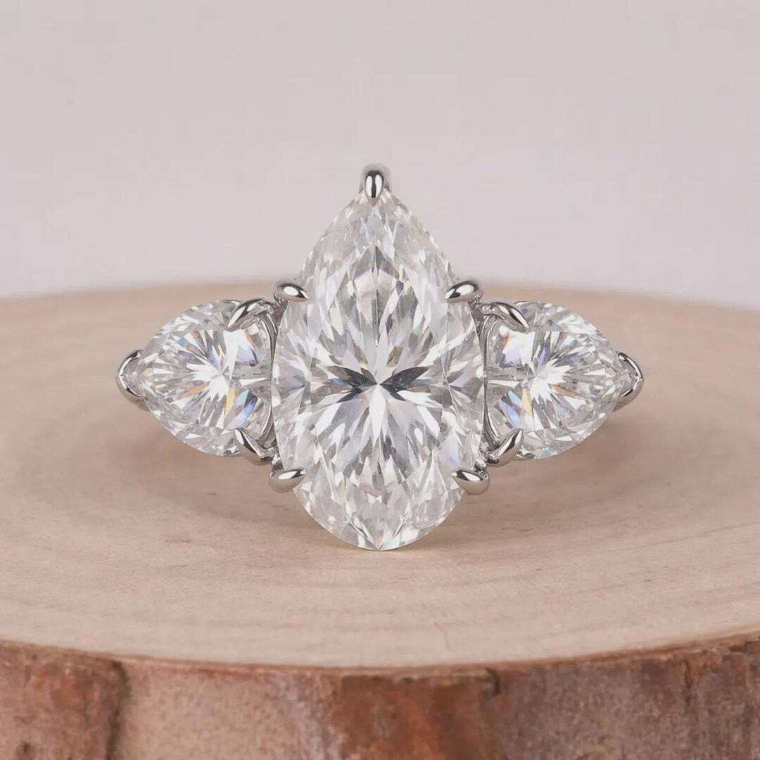 Pear Cut Moissanite Engagement Ring With Heart Side Stones Three Stone ...