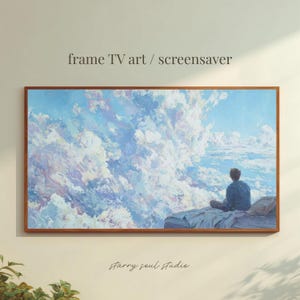 May include: A framed artwork depicting a cloudy sky in blue, white, and purple hues. A person is seated, looking out at the view. The text "frame TV art / screensaver" and "starry soul studio" are displayed on the image.