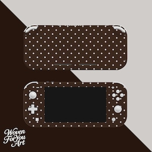 May include: Brown polka dot Nintendo Switch Lite skin. The skin covers the top and bottom of the device. The Switch Lite has a black screen, white buttons, and a white directional pad. The skin has a repeating pattern of white polka dots.