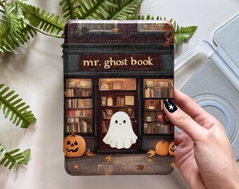 May include: A decorative case featuring a whimsical illustration of a ghost bookshop. The design includes a smiling ghost, pumpkins, and the text "mr. ghost book." The case has a dark, vintage aesthetic, perfect for Halloween or book lovers.