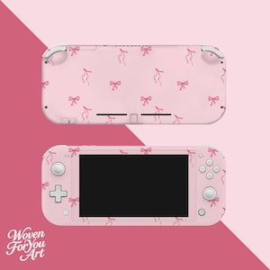 May include: Pink Nintendo Switch Lite console with a matching skin featuring a pattern of pink bows. The console is shown from two angles, top and front, against a pink background. The text "Woven For You Art" is in the lower left corner.