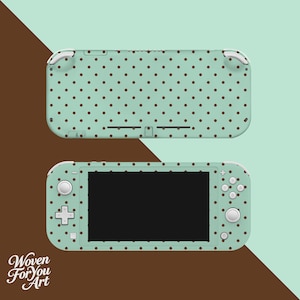 May include: A mint green Nintendo Switch Lite console and top cover, both decorated with a brown polka dot pattern. The console features a black screen, white buttons, and a cross-shaped directional pad. The text "Woven For You Art" is visible.